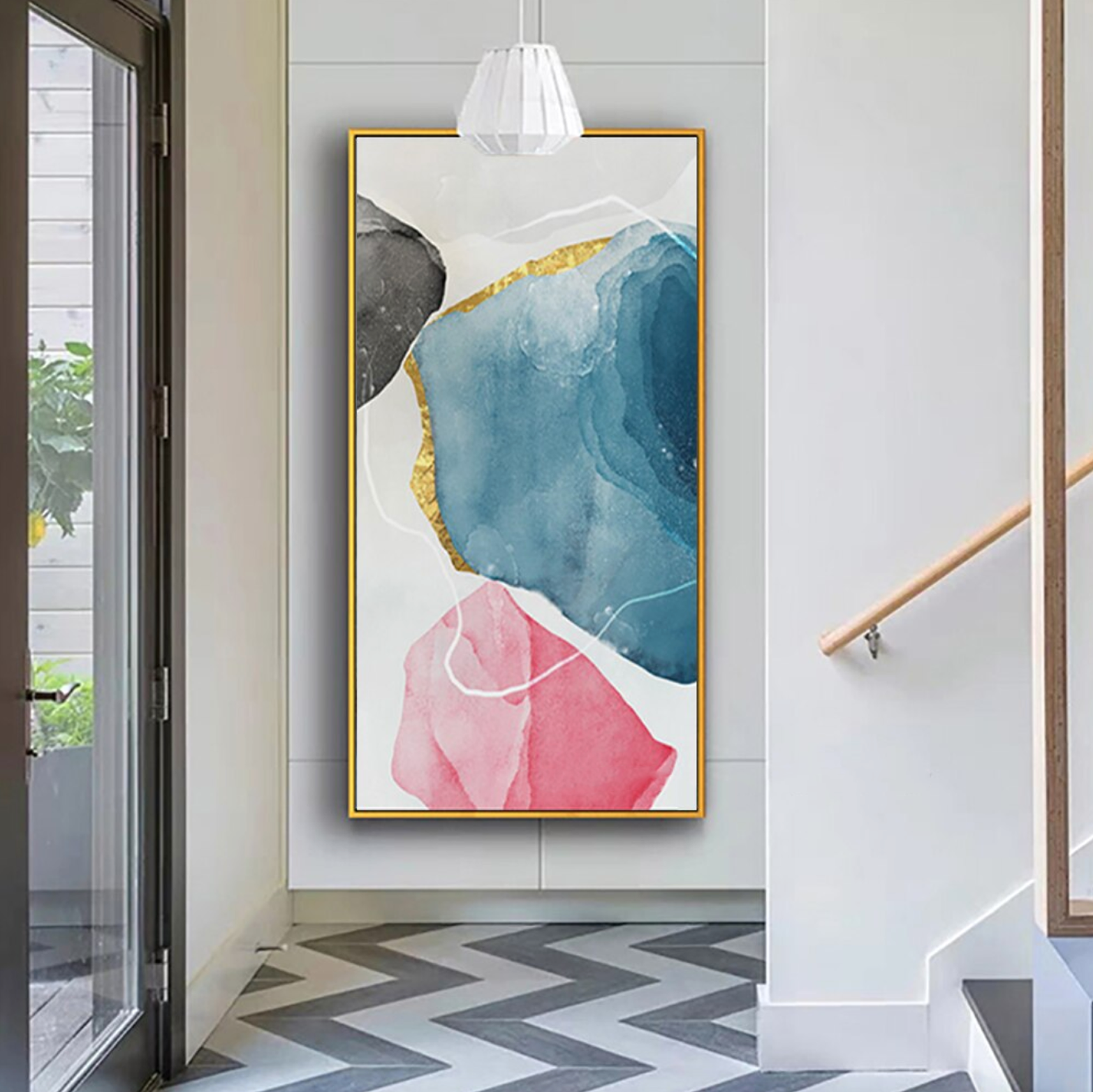 a painting hanging on a wall next to a stair case