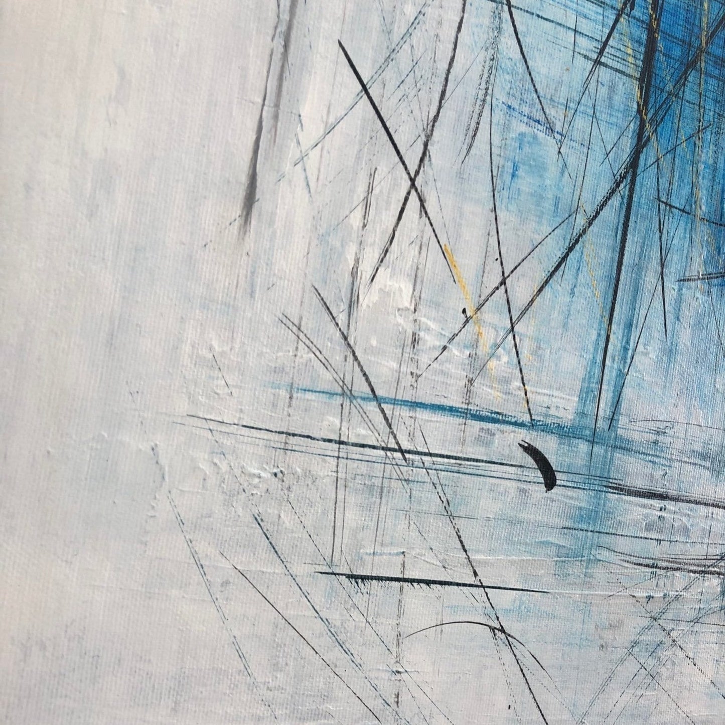 The image is an abstract painting with a mix of blue, black, and white colors. The painting has a textured and expressive appearance, with visible brushstrokes and lines creating a dynamic and expressive visual effect.