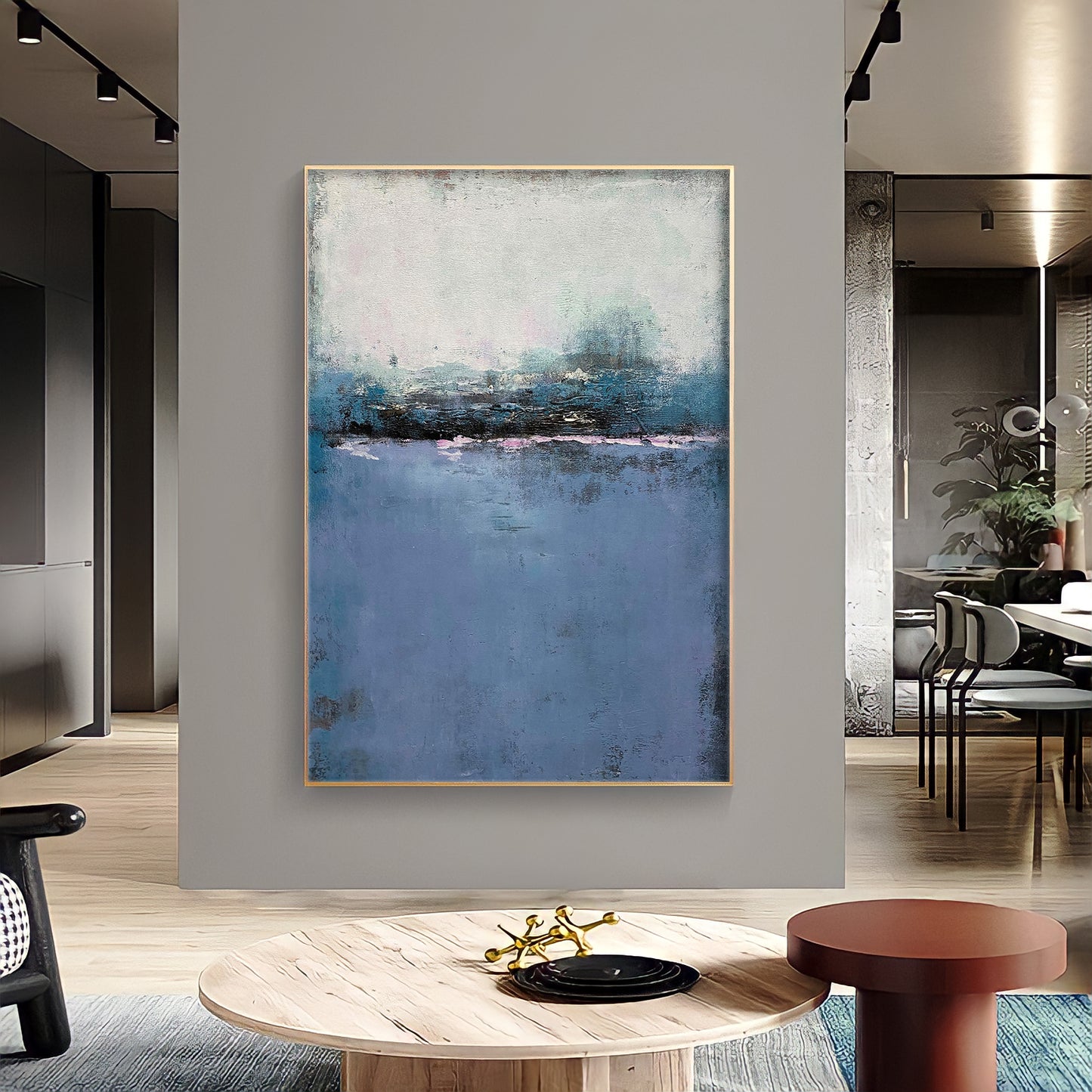 a painting hanging on a wall in a living room