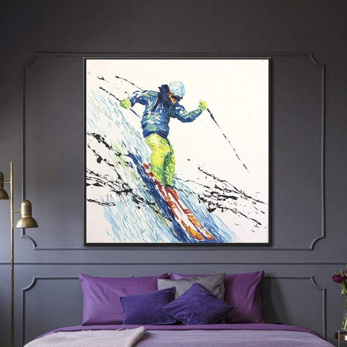 a person skiing down a snowy slope, wearing a blue jacket and yellow pants.