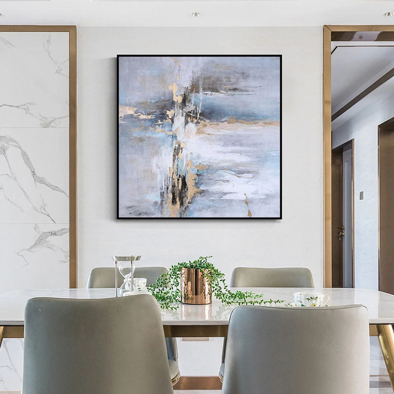 a dining room table with chairs and a painting on the wall