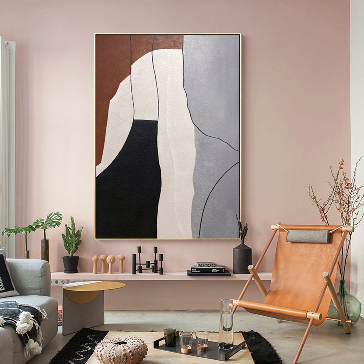 a living room with pink walls and a painting on the wall