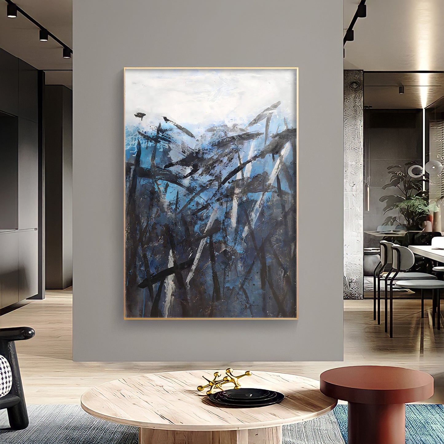 a painting hanging on a wall in a living room