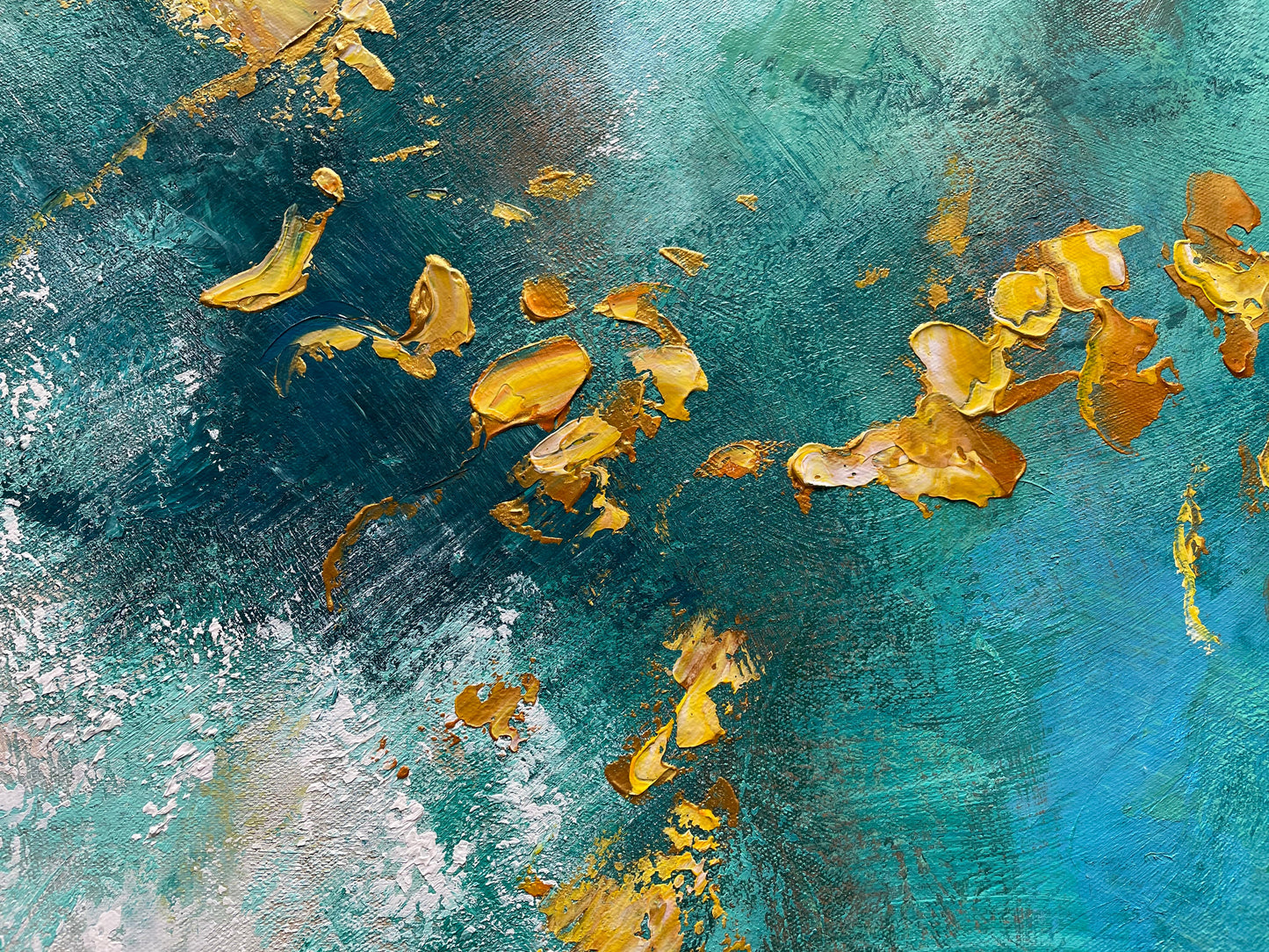 a painting of gold leaves floating on water