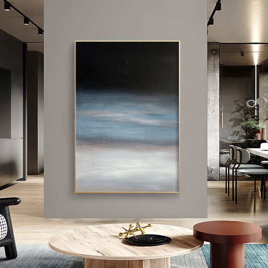 a living room with a large painting on the wall