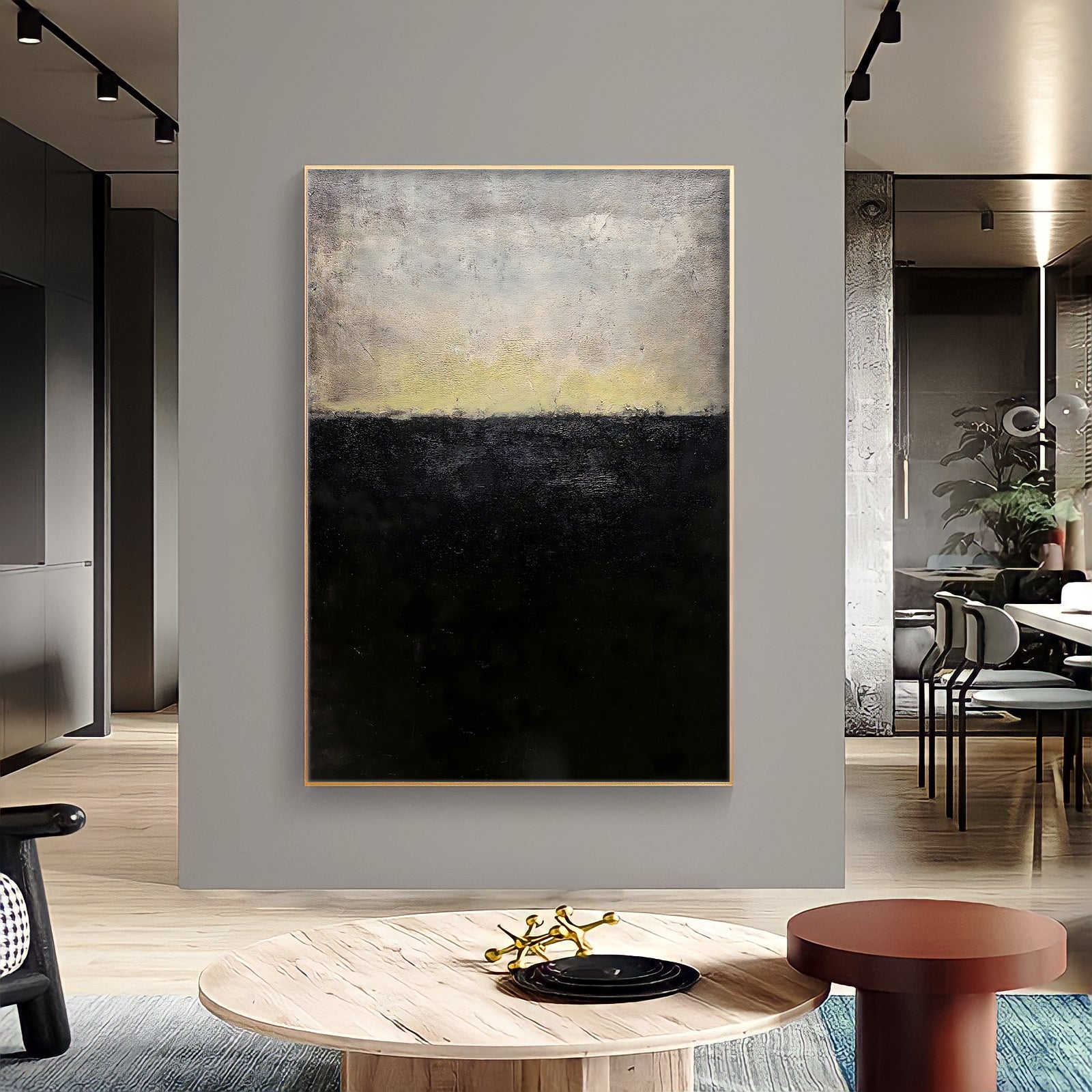 a living room with a large painting on the wall