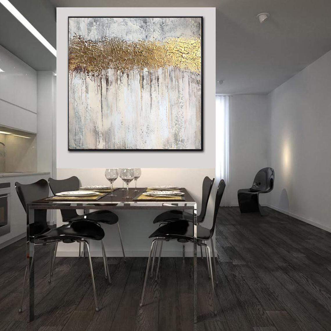 a modern dining room with a large painting on the wall