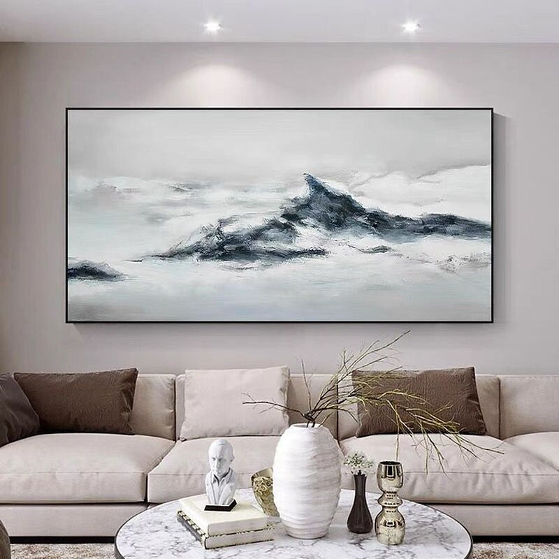 a living room with a large painting on the wall