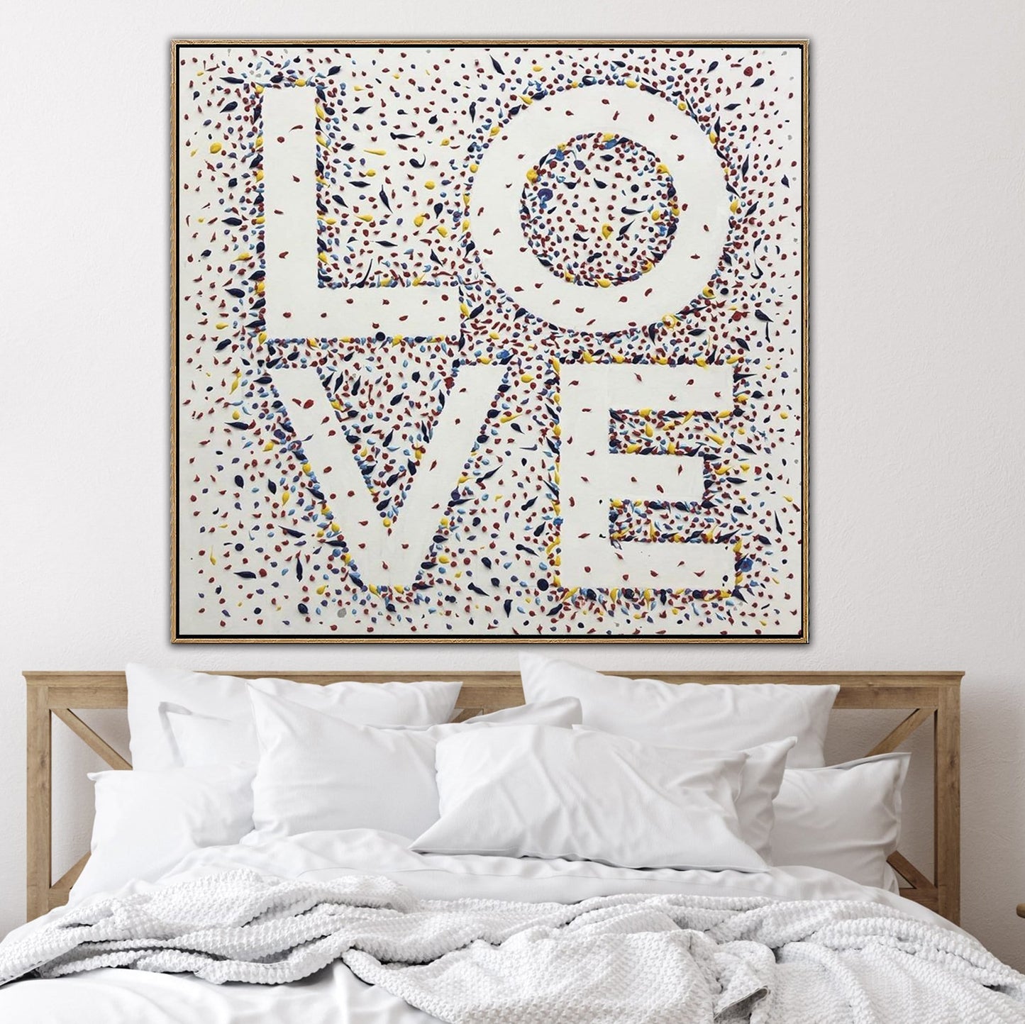 a large, colorful painting or artwork with the word "LOVE" written in bold, decorative letters.