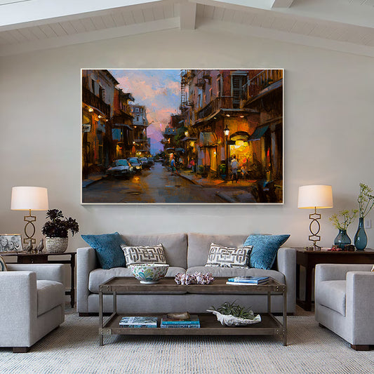 a living room filled with furniture and a painting on the wall