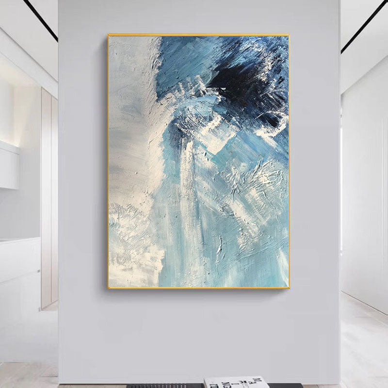 a painting hanging on a wall in a room