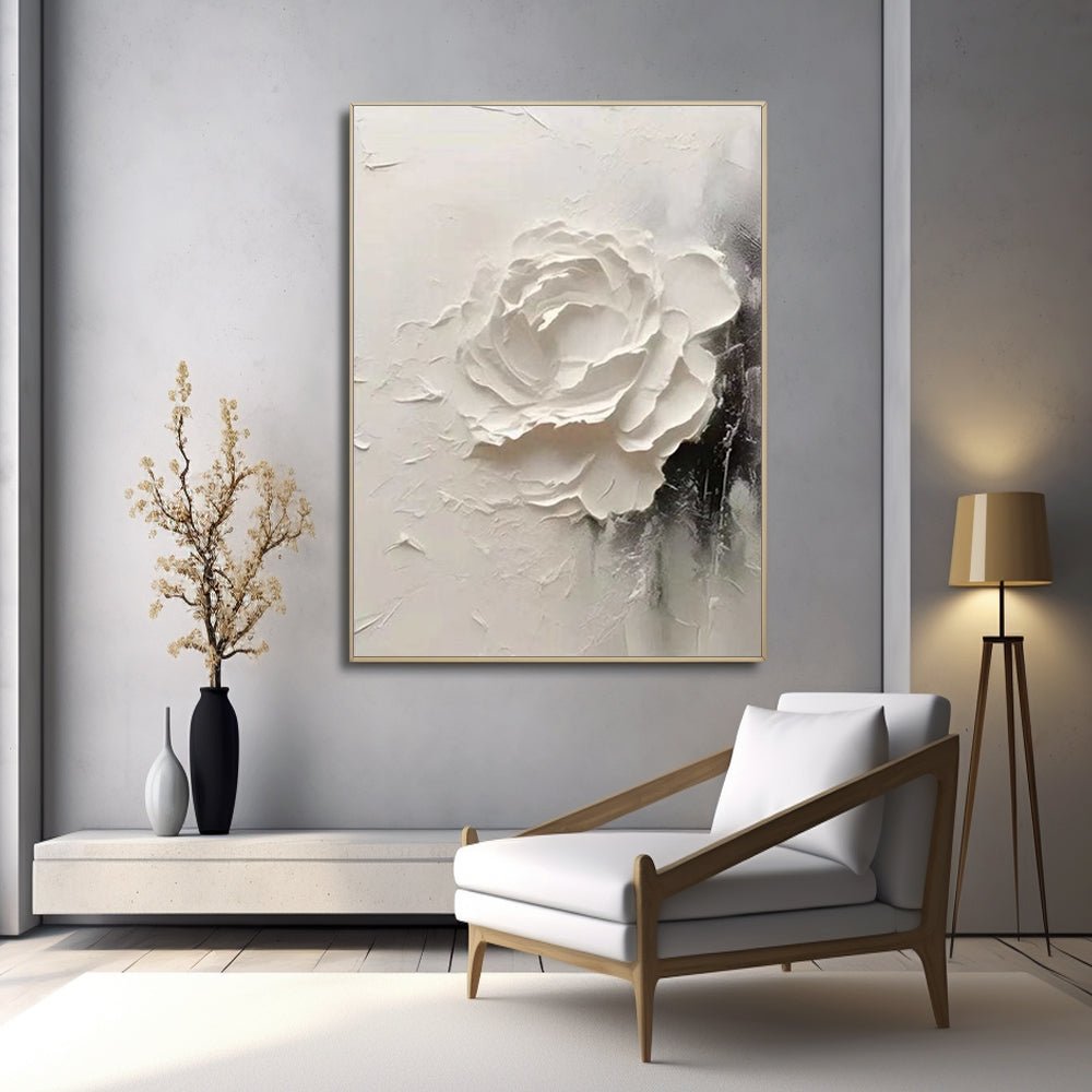 a modern living room with a large white flower painting hanging on the wall, a white armchair, and a wooden floor lamp.