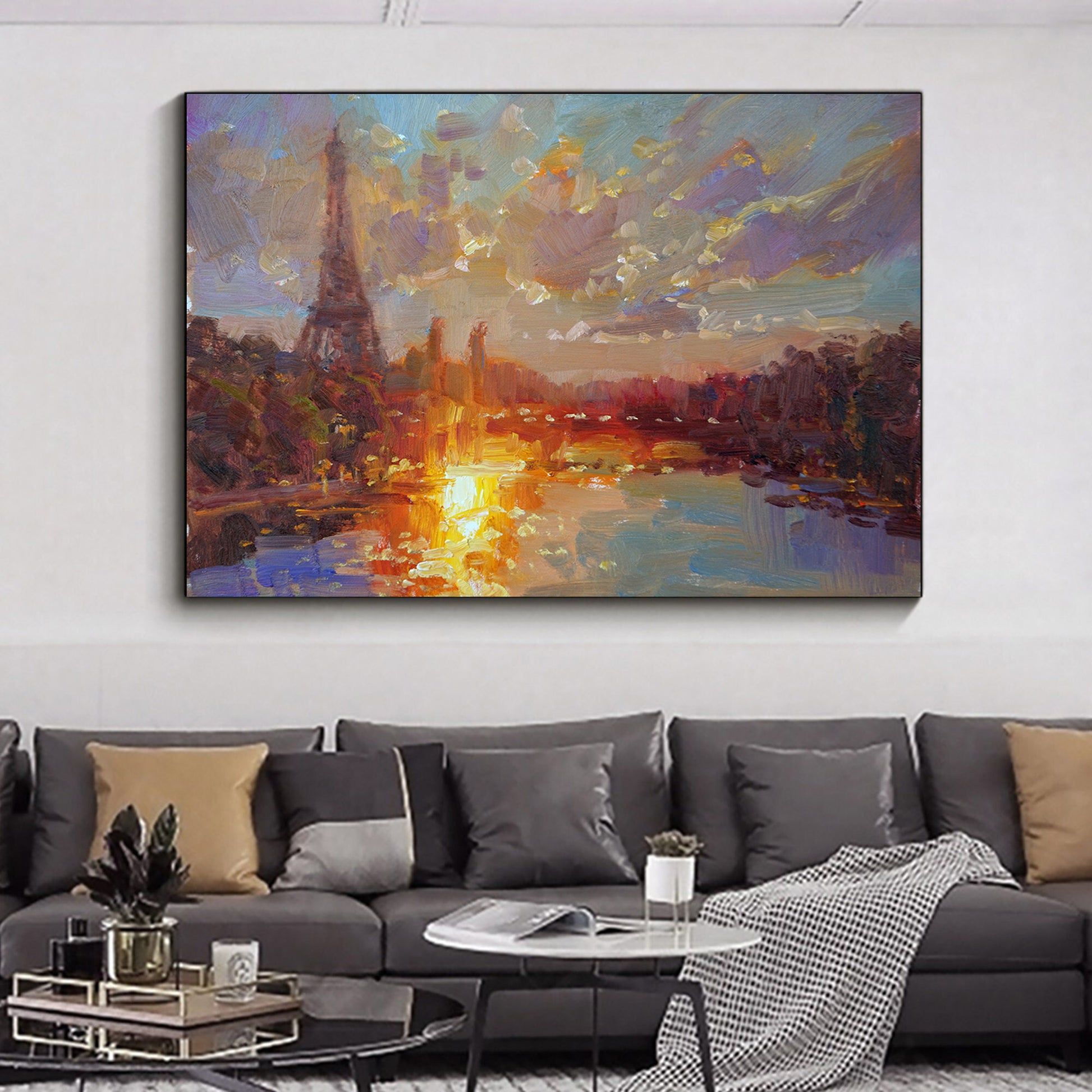 a living room with a large painting on the wall