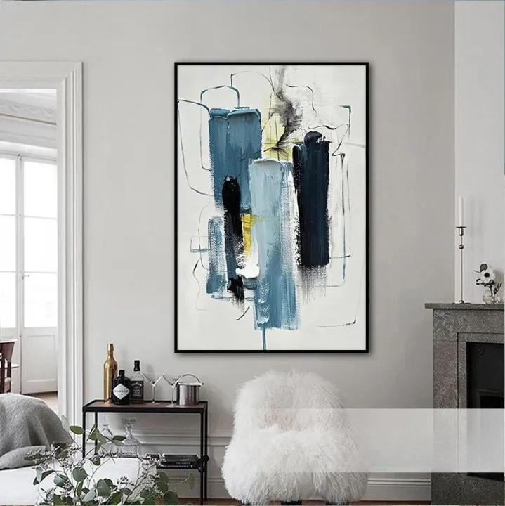 a large abstract painting hanging on a wall in a living room.