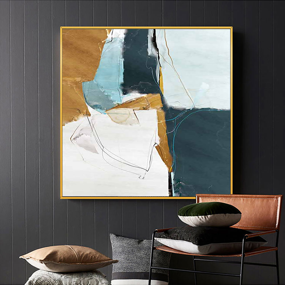 a painting hanging on a wall next to a chair