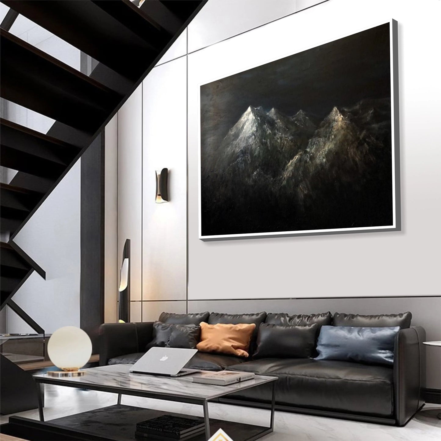 a modern living room with a large black and white painting of mountains hanging on the wall above a black leather sofa. The room has a sleek, minimalist design with a black staircase and a glass coffee table in the center.