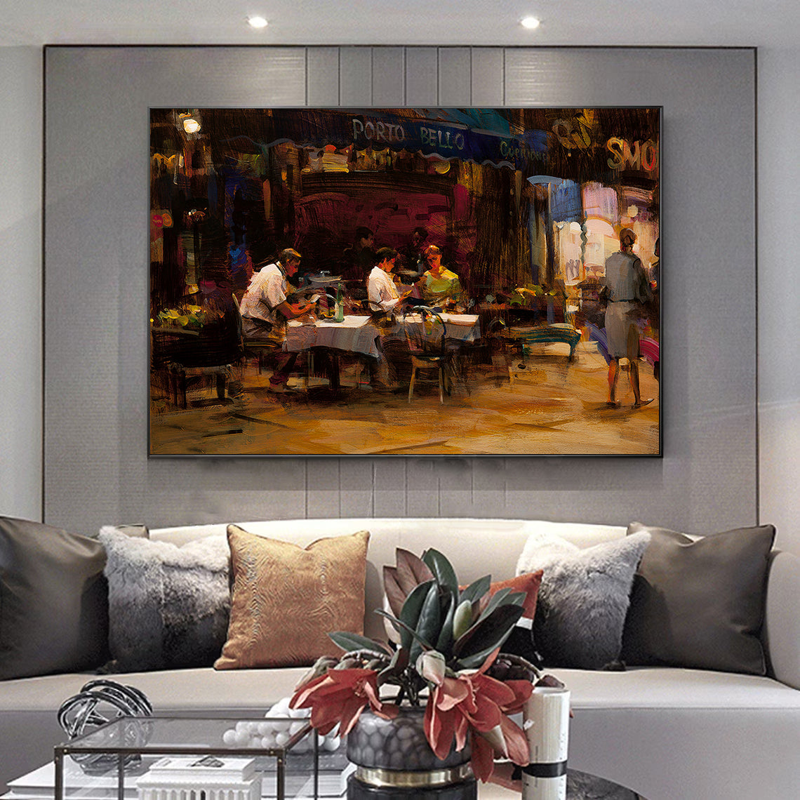 a living room with a couch and a painting on the wall