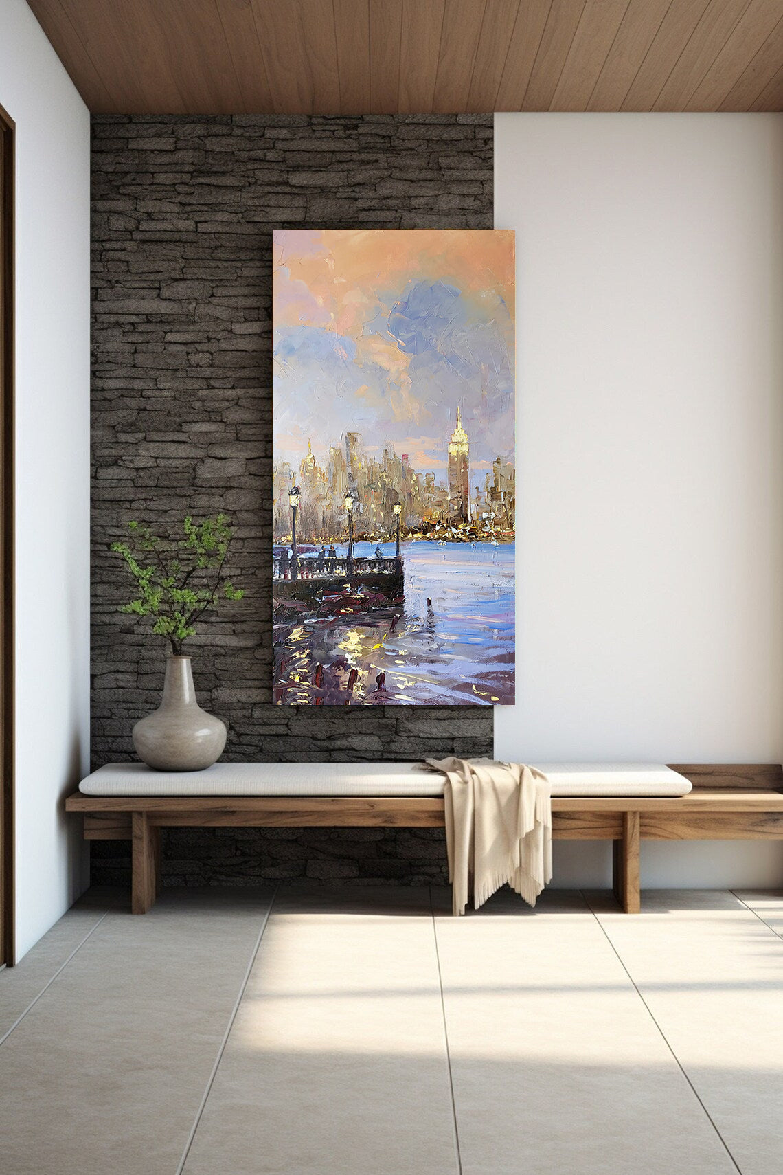 a painting of a cityscape on a wall next to a bench