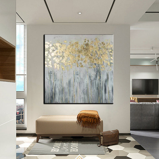 a living room with a couch and a painting on the wall
