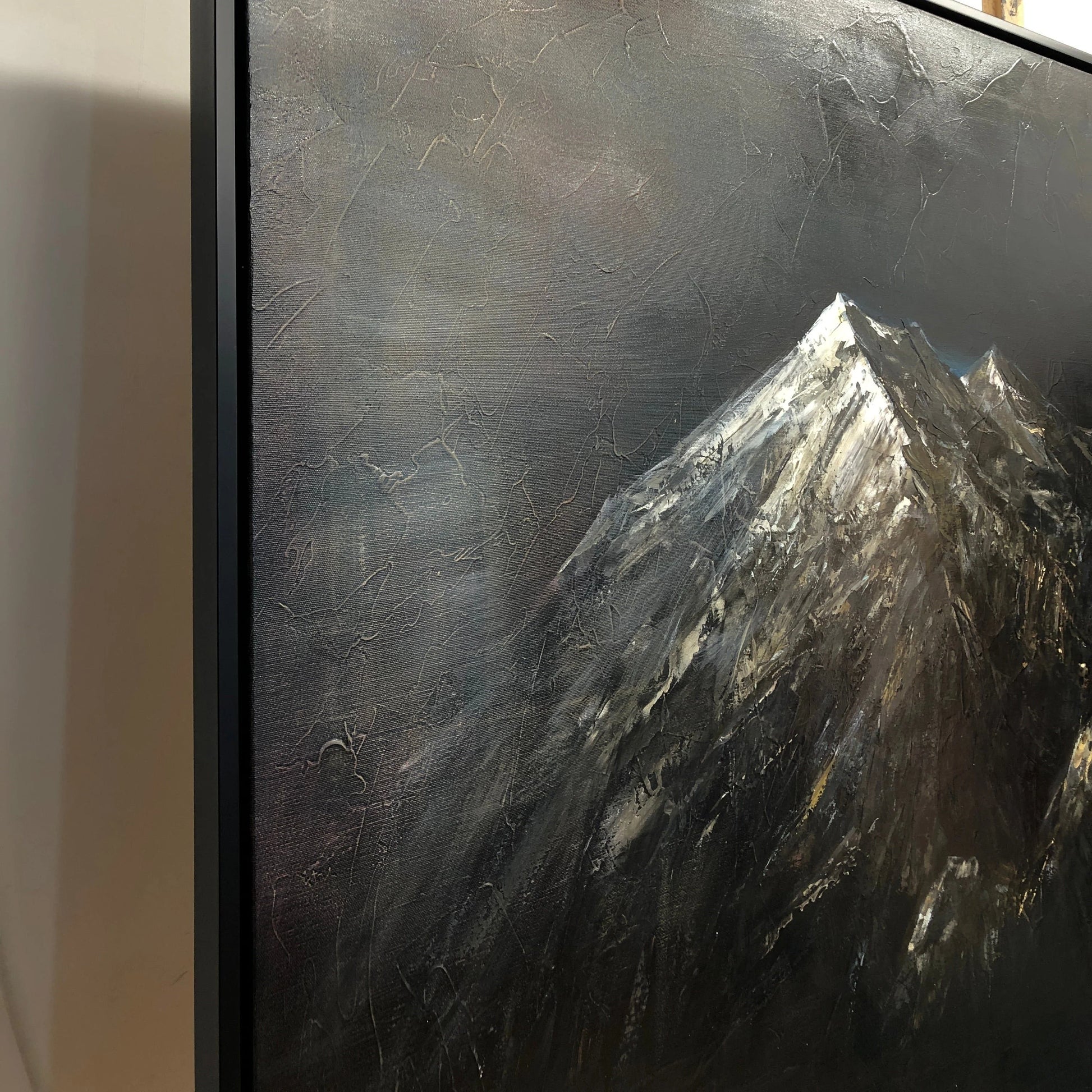 a majestic mountain range with a dark, textured background.