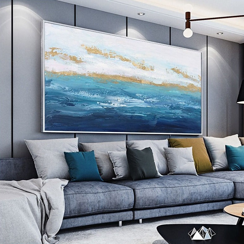 a living room filled with furniture and a painting on the wall