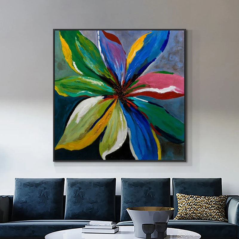 a living room with a couch and a painting on the wall