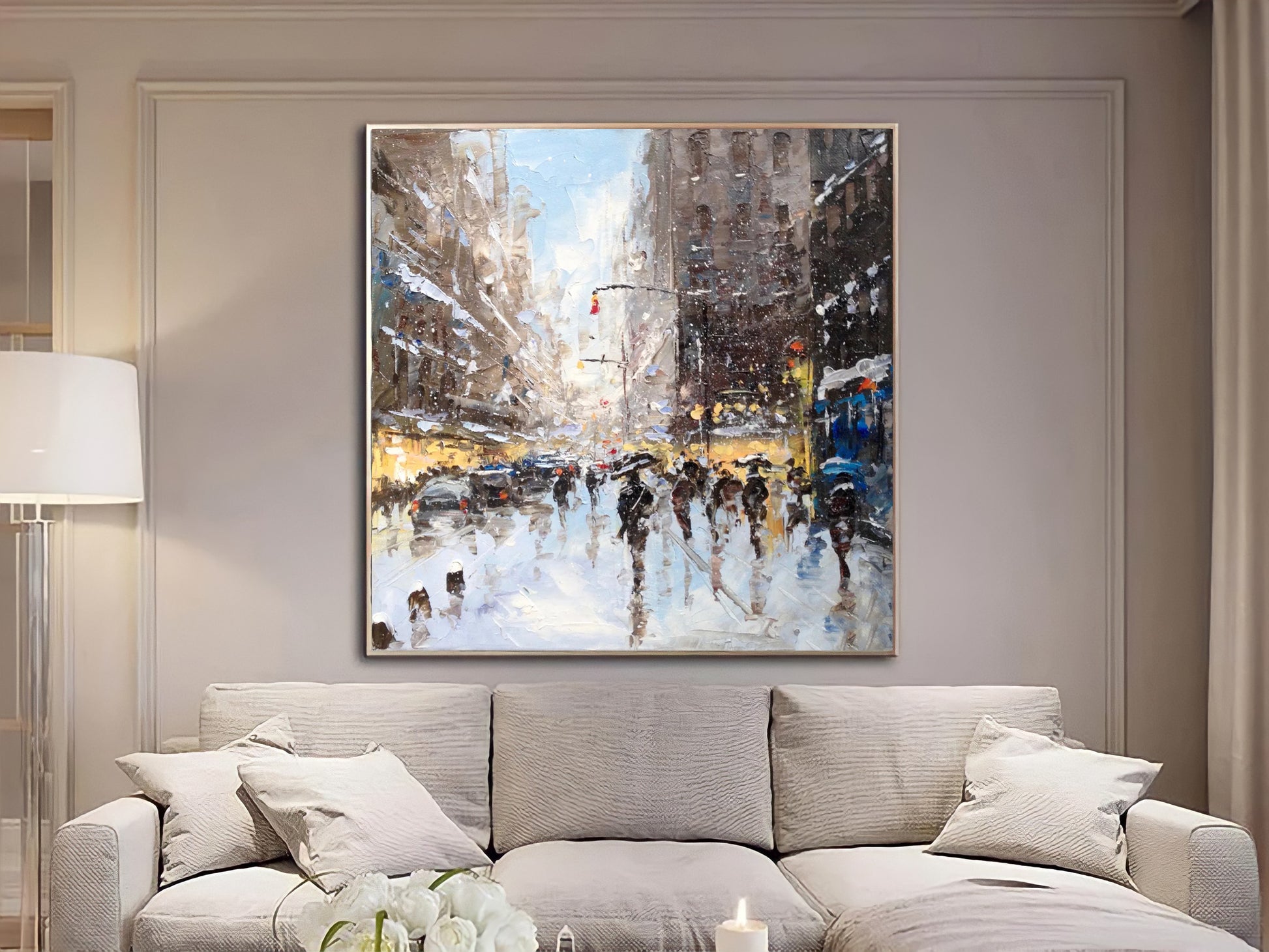 a living room with a couch and a painting on the wall