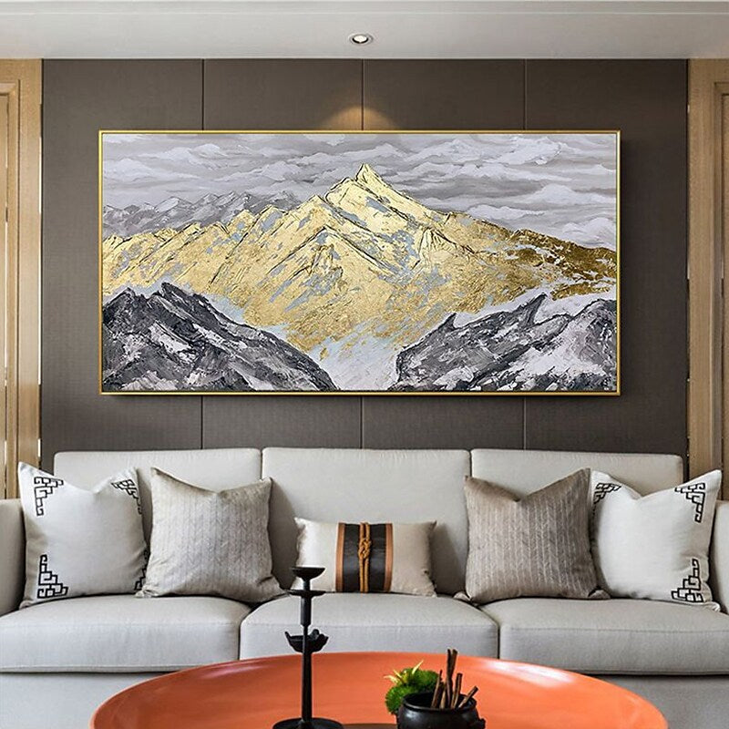 a living room filled with furniture and a painting on the wall