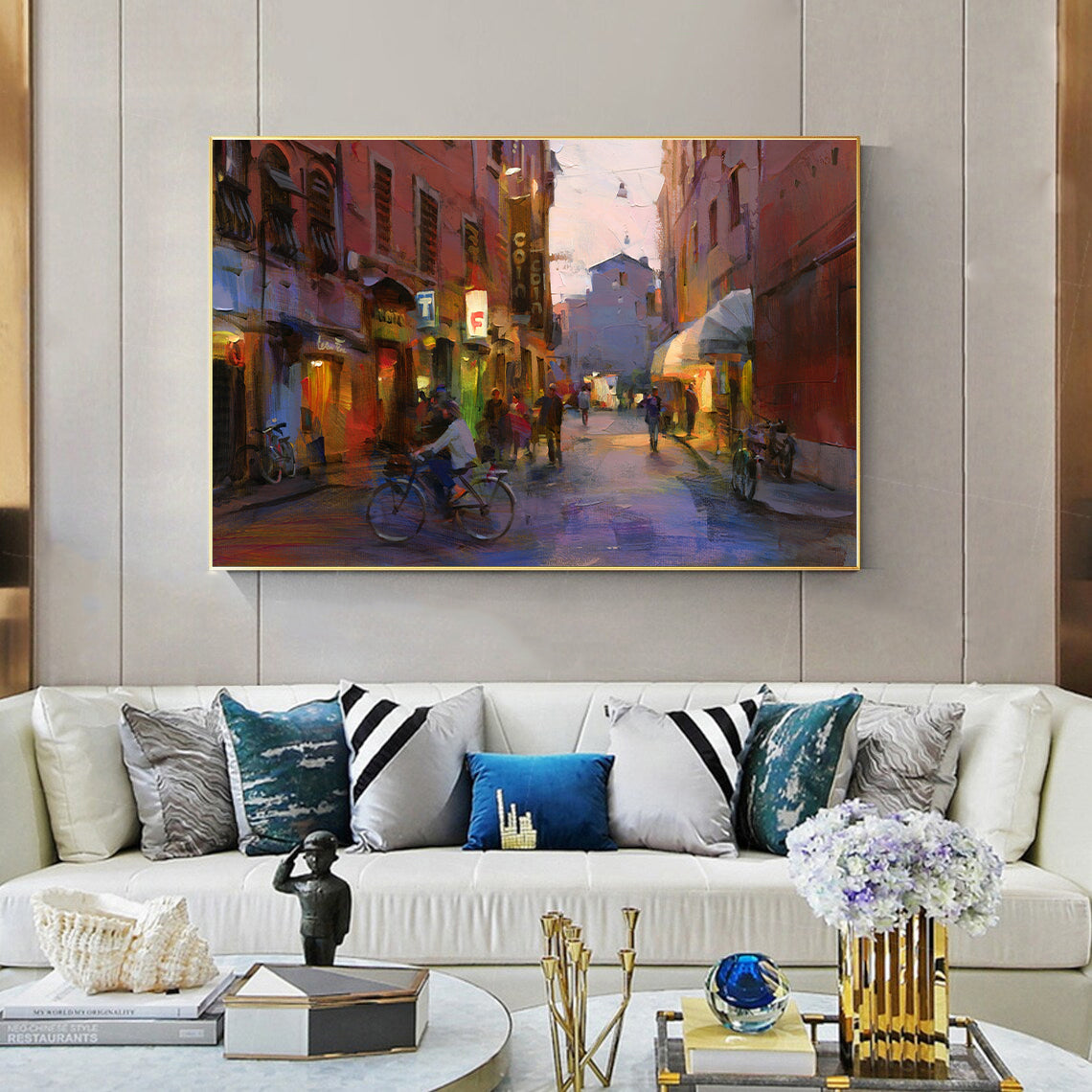 a living room filled with furniture and a painting on the wall