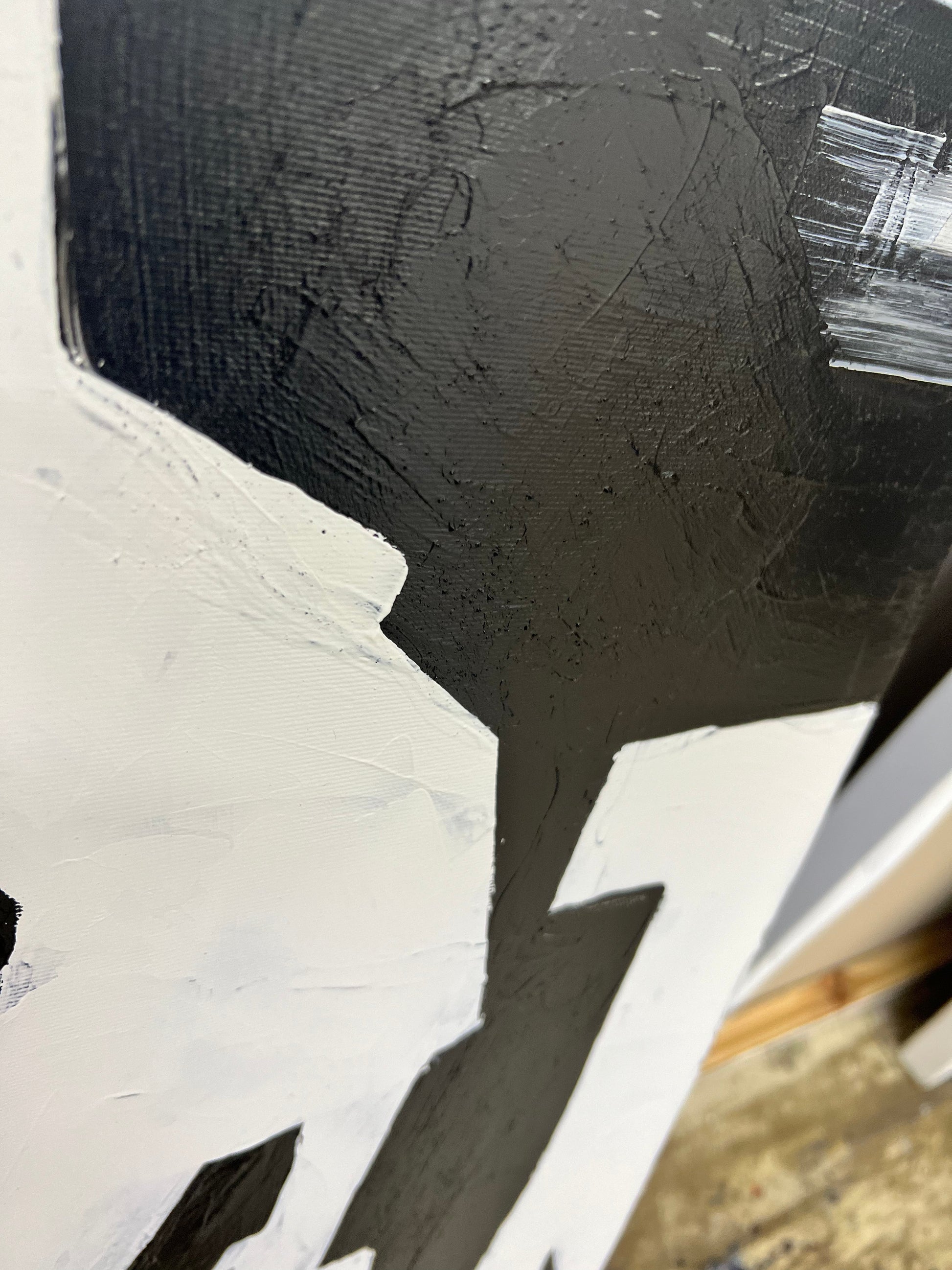 a close up of a black and white painting