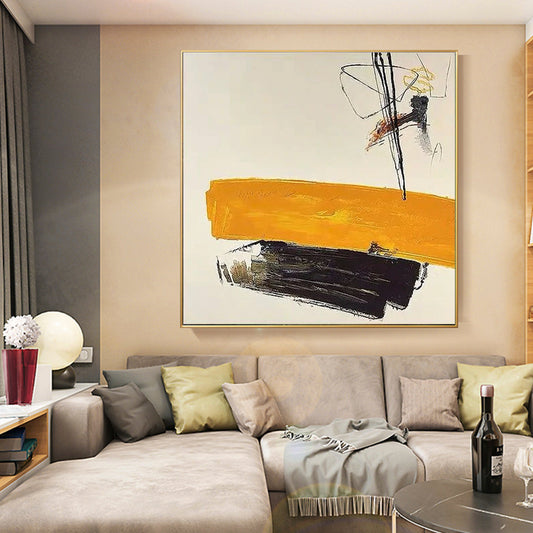 a living room filled with furniture and a painting on the wall