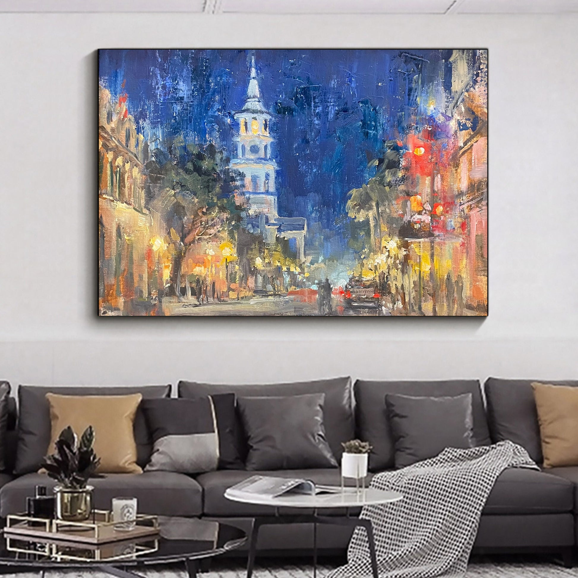 a living room with a large painting on the wall