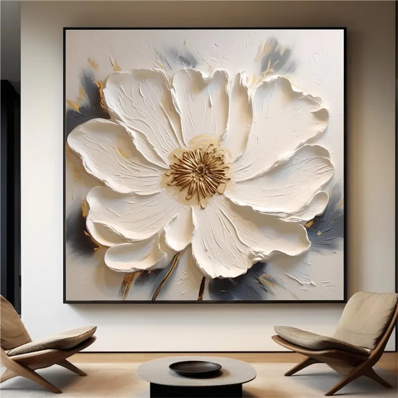 a painting of a white flower in a living room