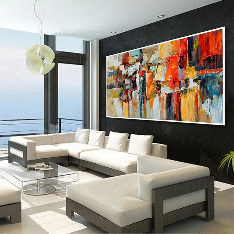 a living room with a large painting on the wall