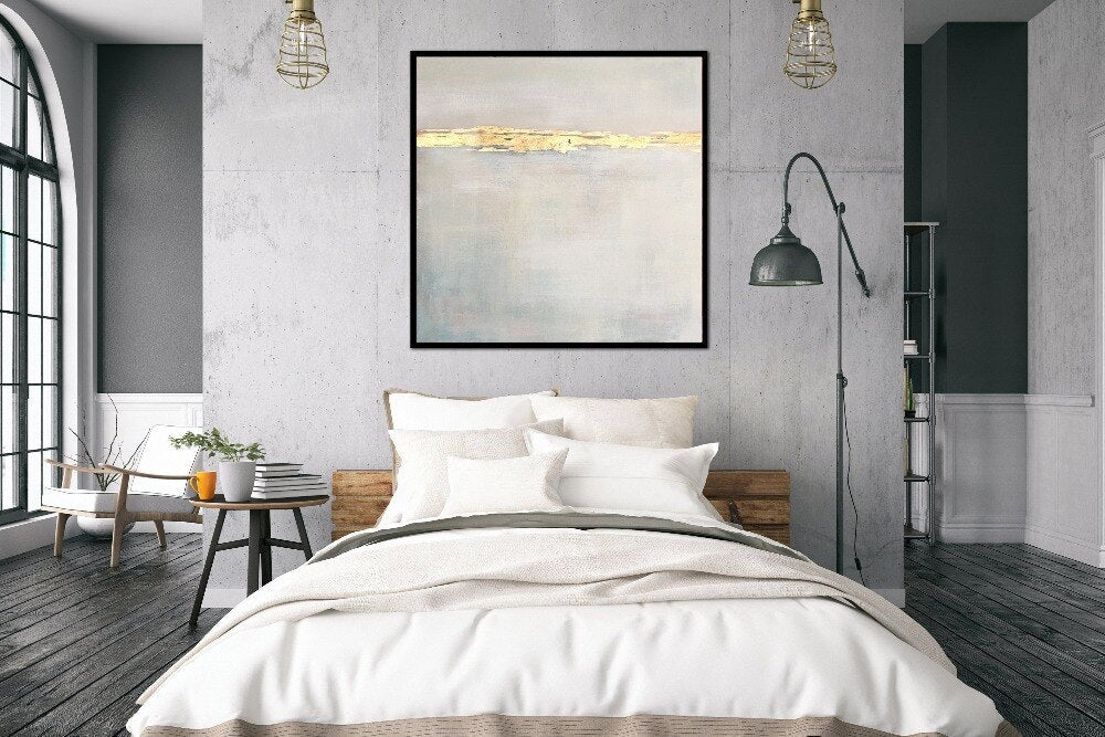 a bedroom with a large painting on the wall