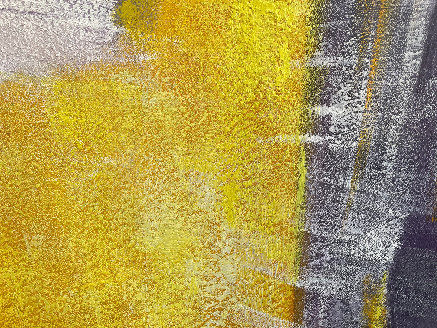 a painting of yellow and grey on a wall