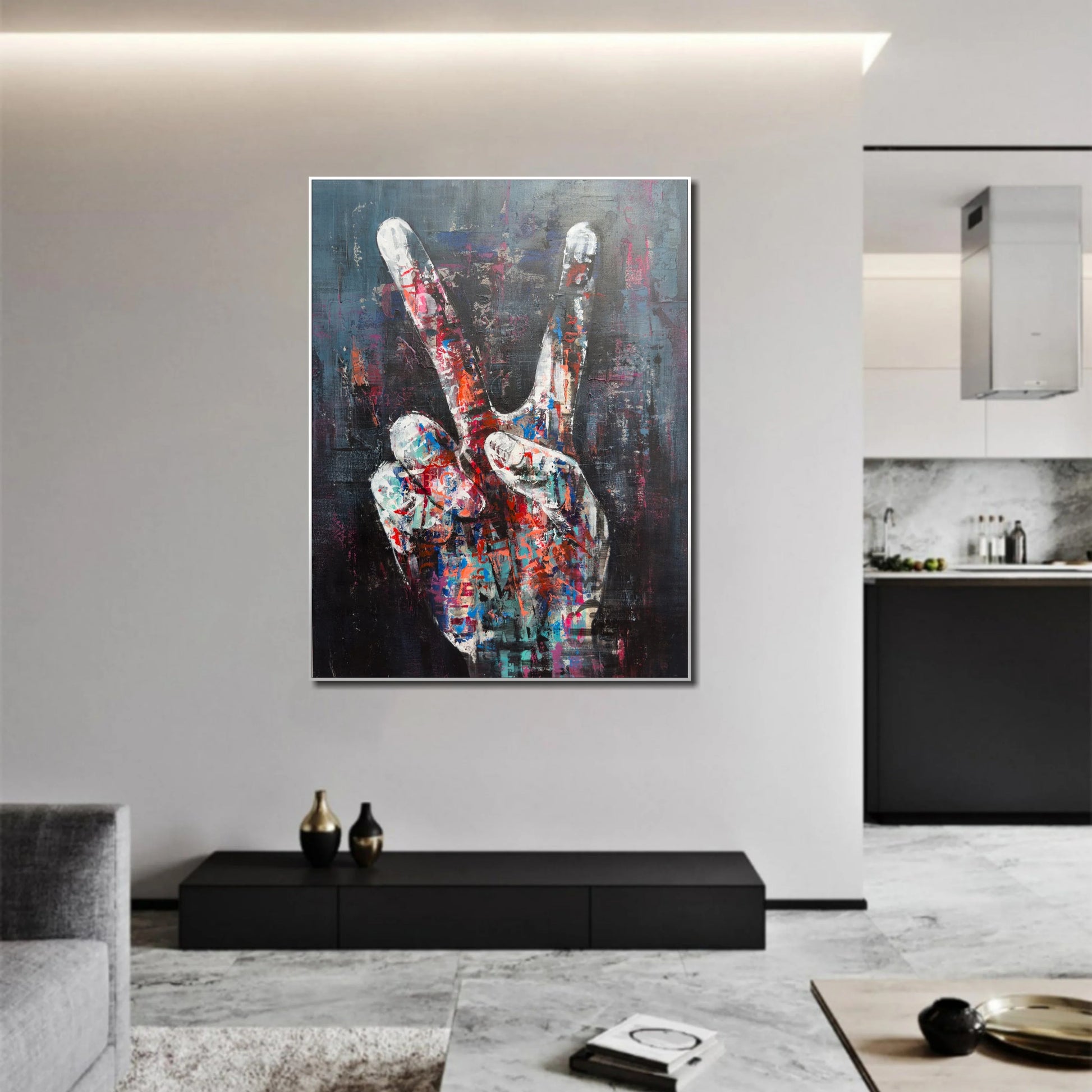 a large, colorful abstract painting of a hand making a peace sign on a wall in a modern living room setting.