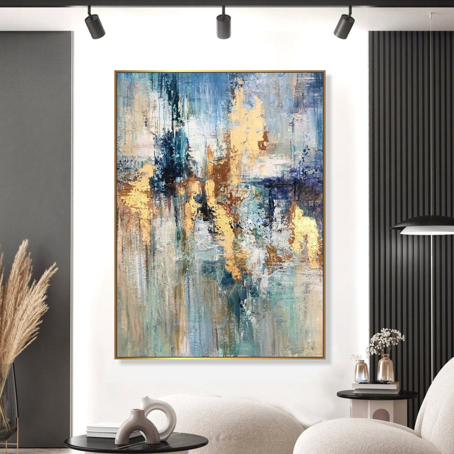 a large abstract painting hanging on a white wall in a modern living room setting.