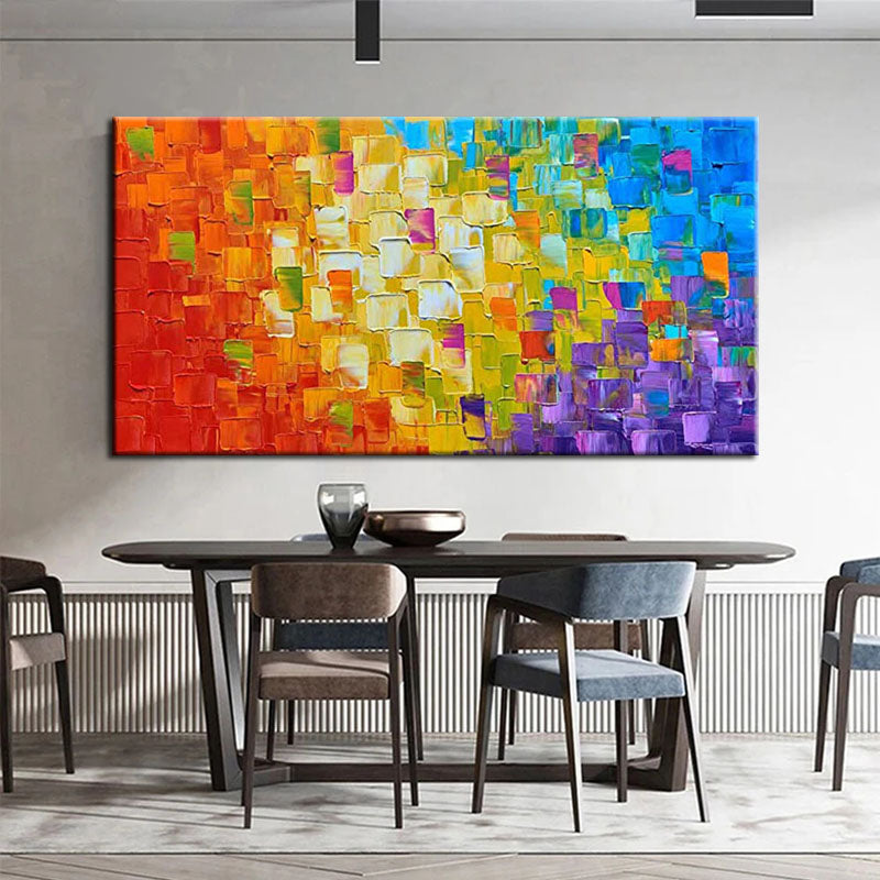 a dining room table with chairs and a painting on the wall