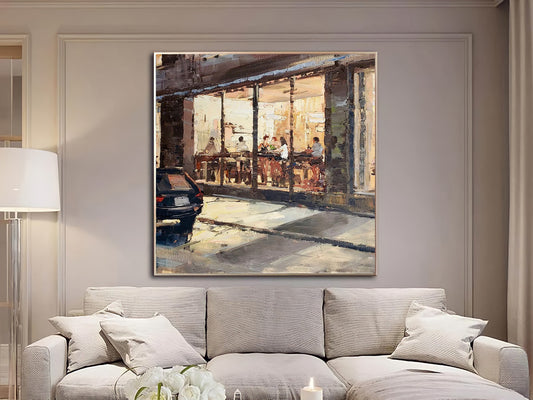 a living room with a couch and a painting on the wall