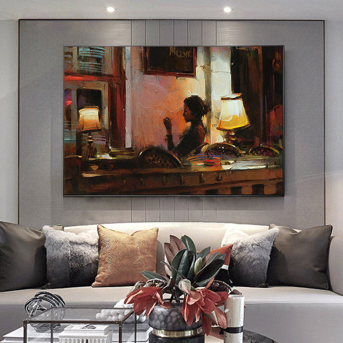 a living room with a couch and a painting on the wall