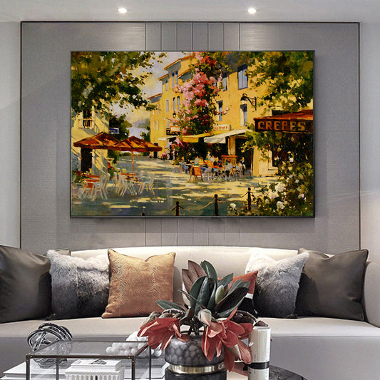 a living room filled with furniture and a painting on the wall