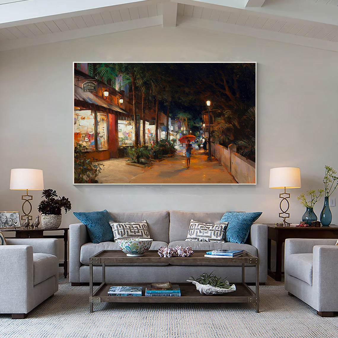 a living room filled with furniture and a painting on the wall