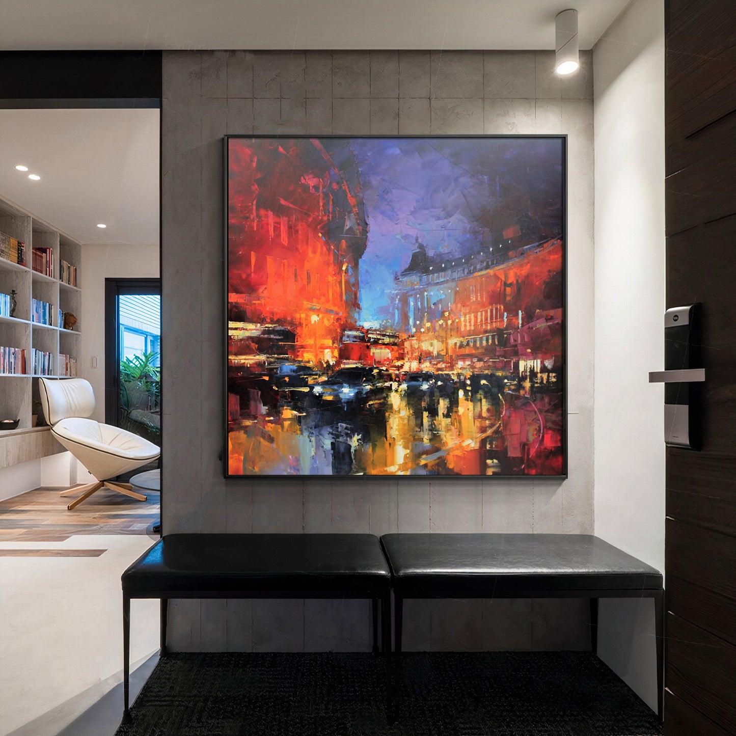 a painting of a cityscape is hanging on a wall