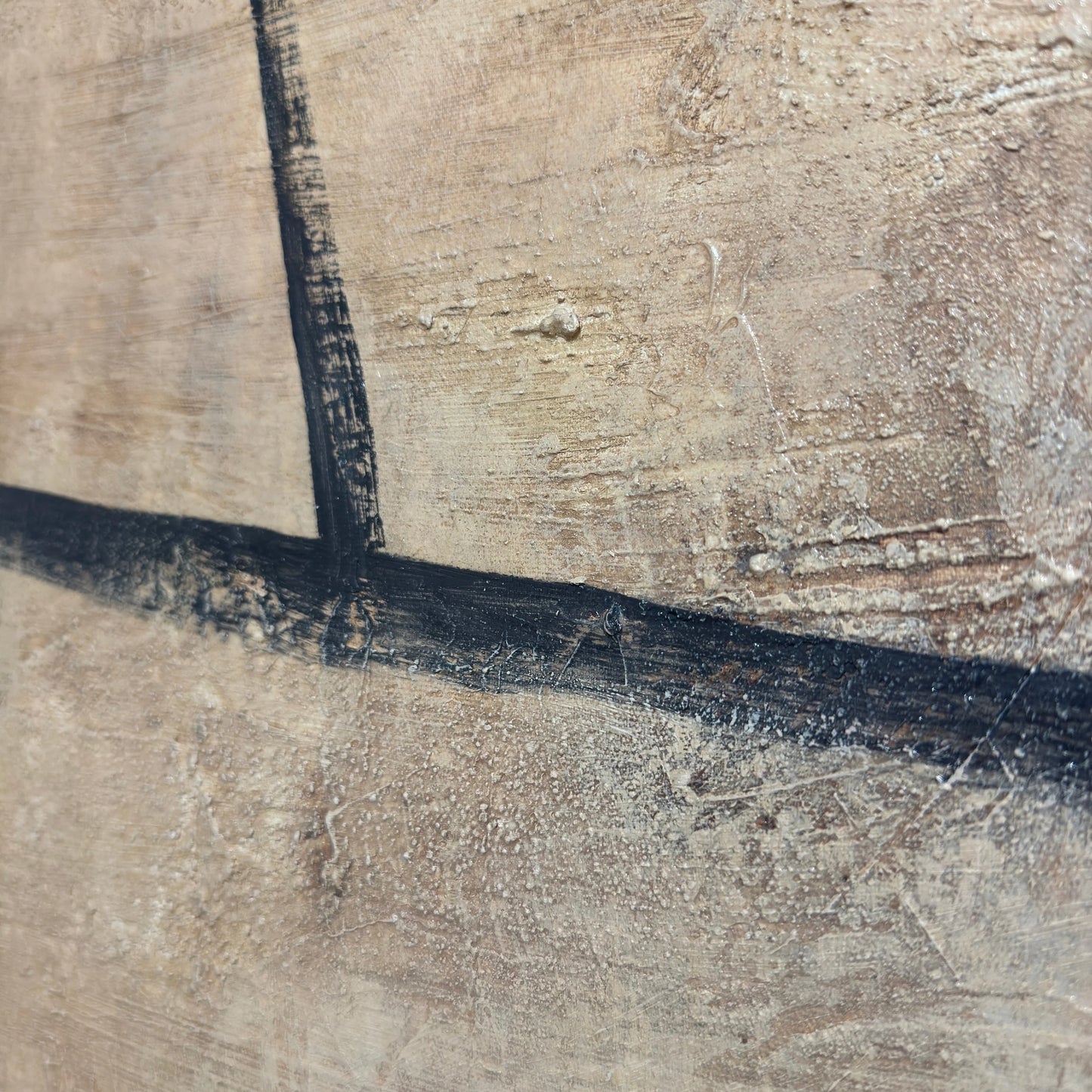 a close-up view of a textured surface with a black line running across it.