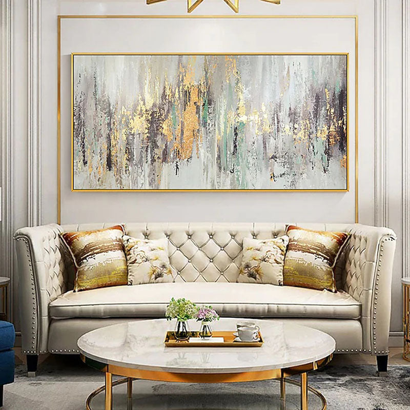 a living room filled with furniture and a painting on the wall