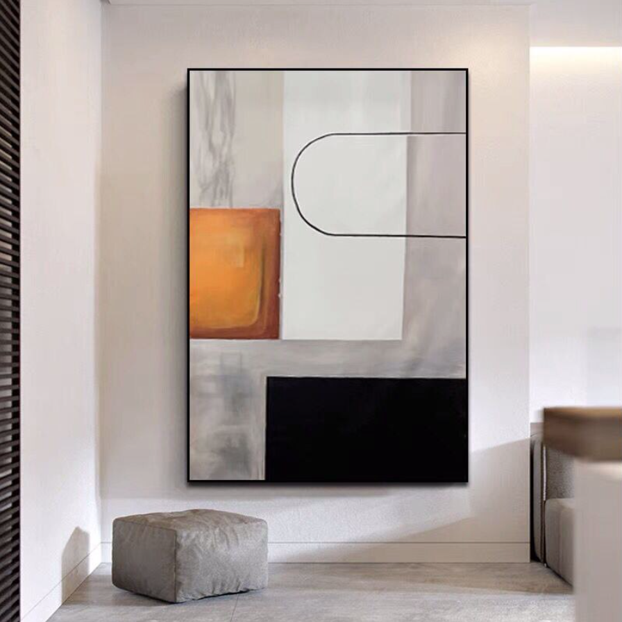 a painting hanging on a wall in a room