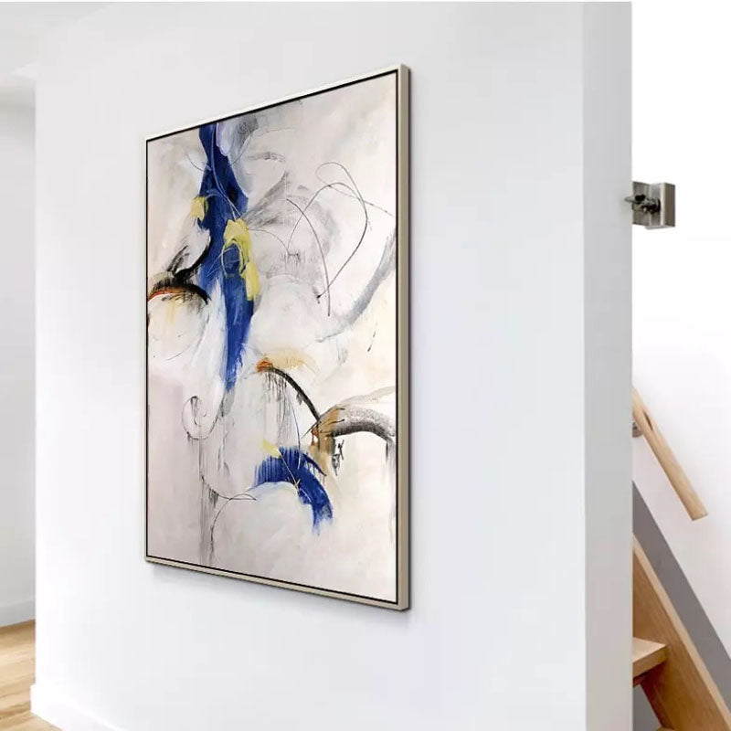 a painting hanging on a wall next to a stair case