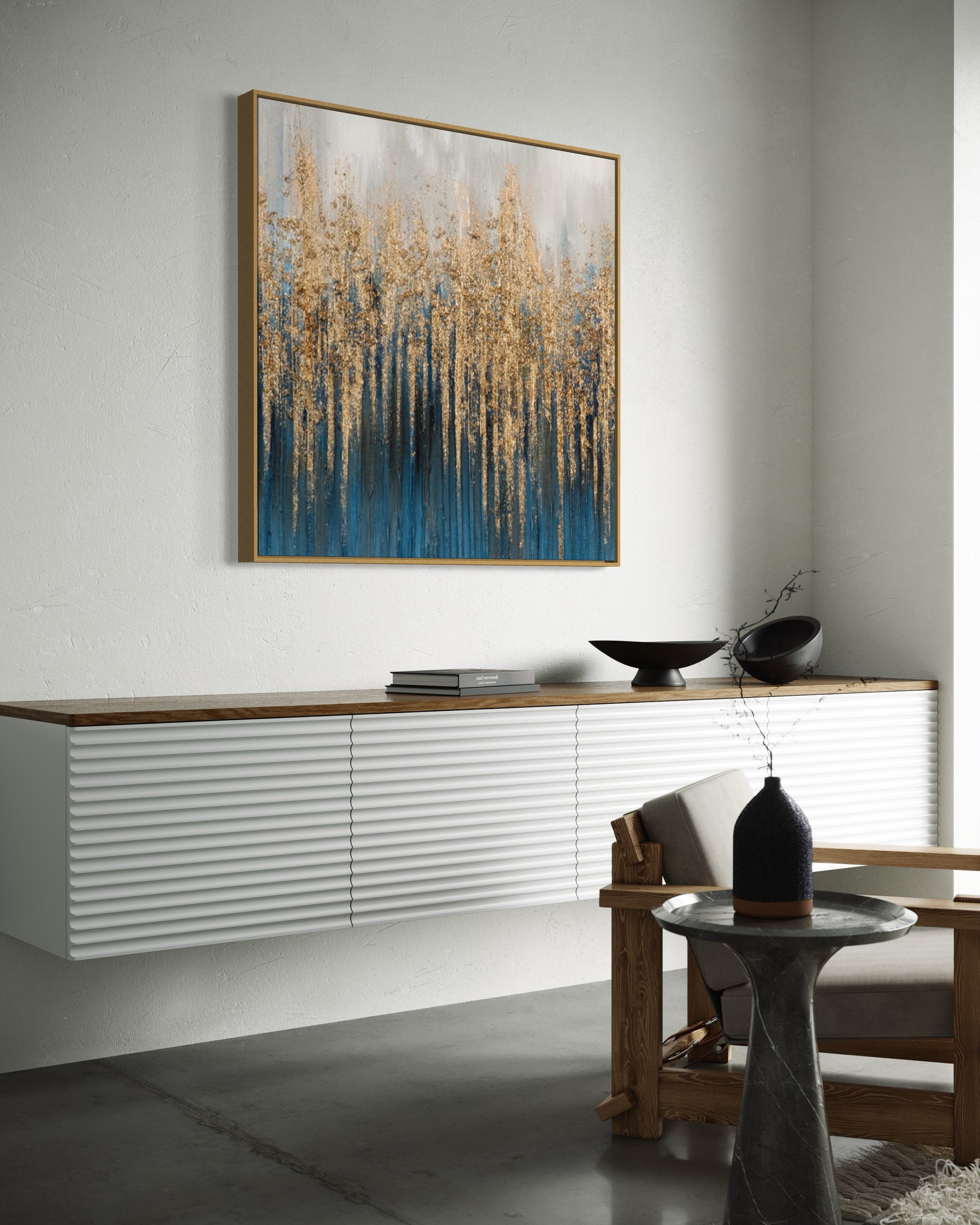 a painting hanging on a wall above a table