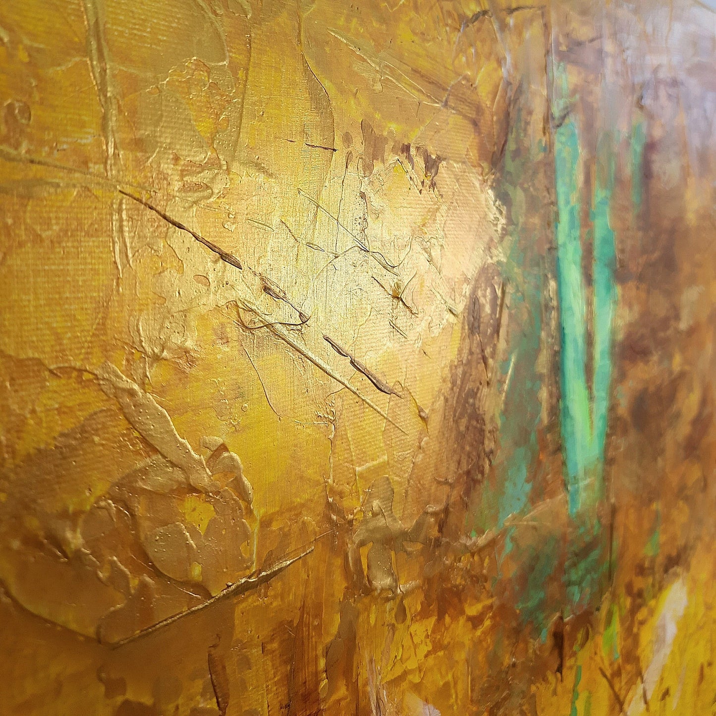 The image is an abstract painting with a textured surface in shades of yellow and brown, featuring a mix of brushstrokes and splatters.